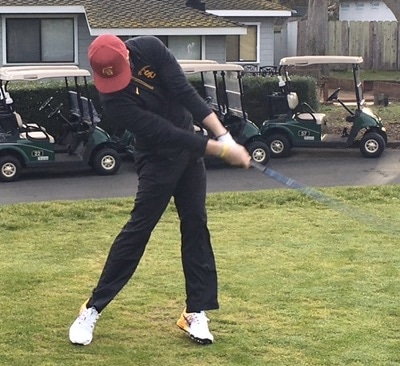 Christmas Classic leader Sean Crocker rips a drive off No. 1<br>-- you can't see him under the hat, but trust us it's him!