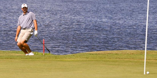 Ty Gingerich watching his eagle attempt at the par-5 9th<br>(Will Brown/St. Augustine Record photo)